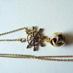 Ship Wheel And Sailors Knot Necklace In Gold Metal