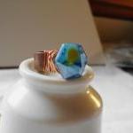 Blue Faceted Hexagon Ring With Copper Wire Wraps