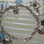 Charm Bracelet With Vintage Charms In Silver Metal
