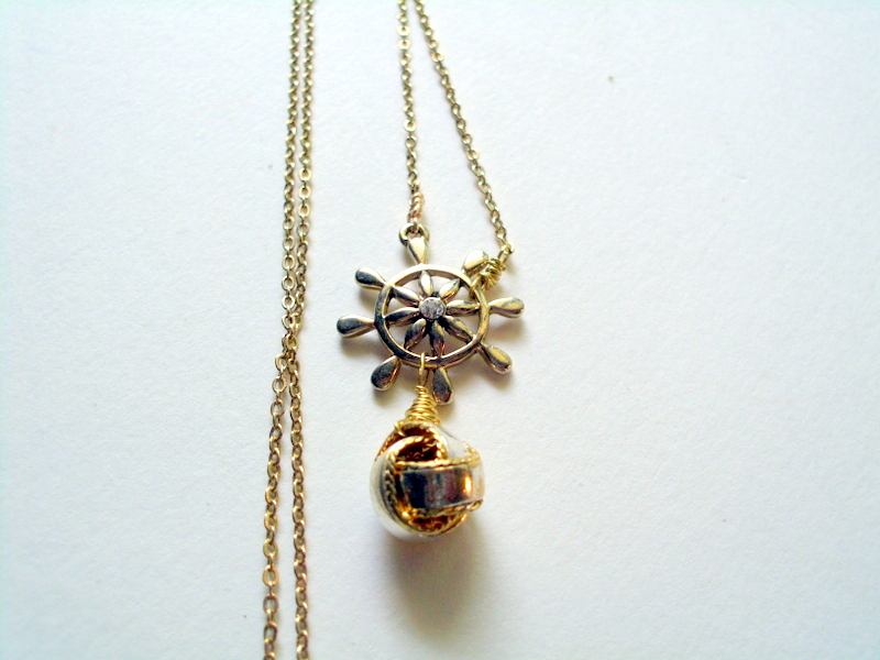 Ship Wheel And Sailors Knot Necklace In Gold Metal